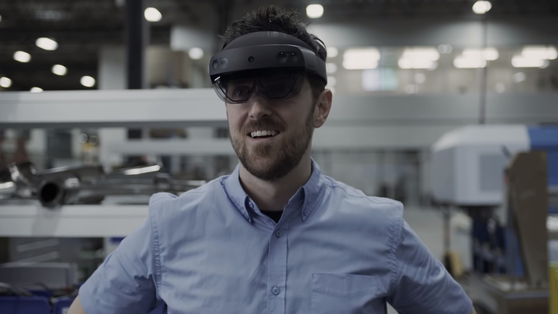 A man with HoloLens 2 on his head