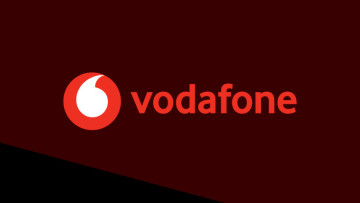 The Vodafone logo on a dark red and black background