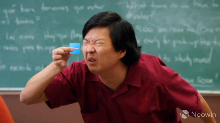 A man squinting to see a small Windows 11 logo