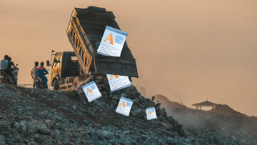 A dump truck dumping WordPad icons into a landfill